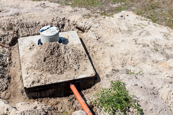 signs that your septic tank needs pumping include slow drains, sewage backups, and foul odors